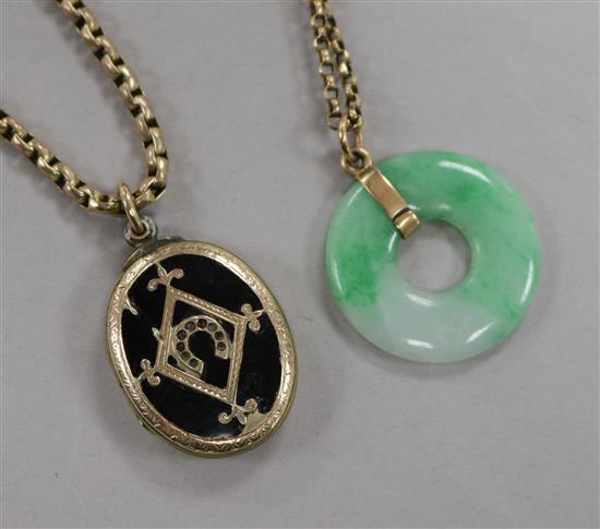 A Victorian gold overlaid and enamel locket with yellow metal chain and a jadeite disc pendant on a yellow metal chain.